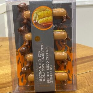 NWOT.  Outset, set of 4, Dachshund Hot Dog, corn holders.